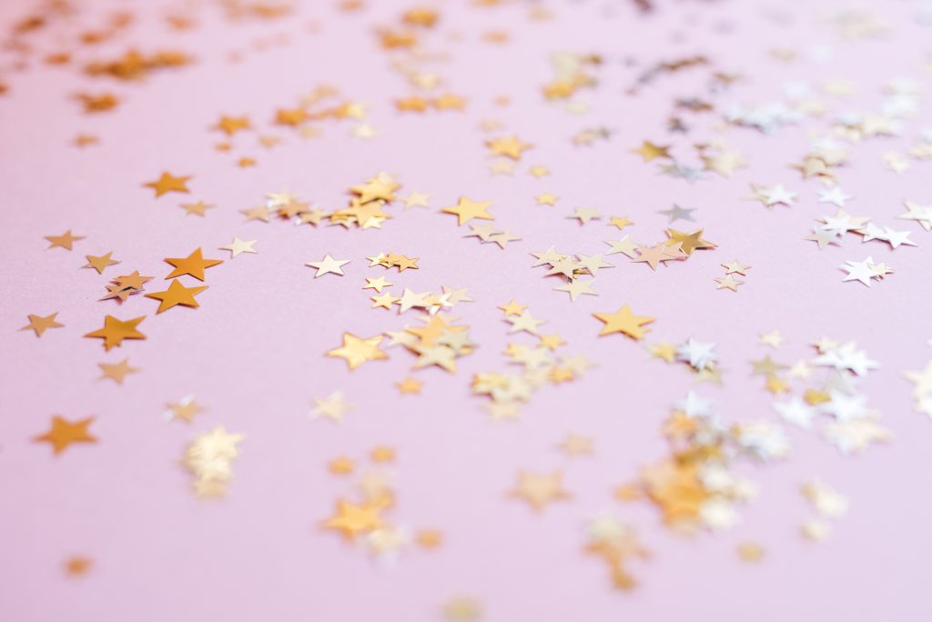 pink background with gold stars