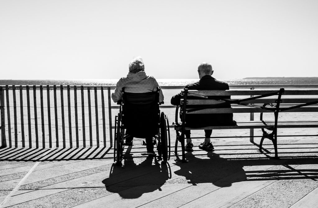 old couple sitting on bench